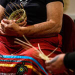Monacan elder holding a handwoven basket Monacan elder holding a handwoven basket